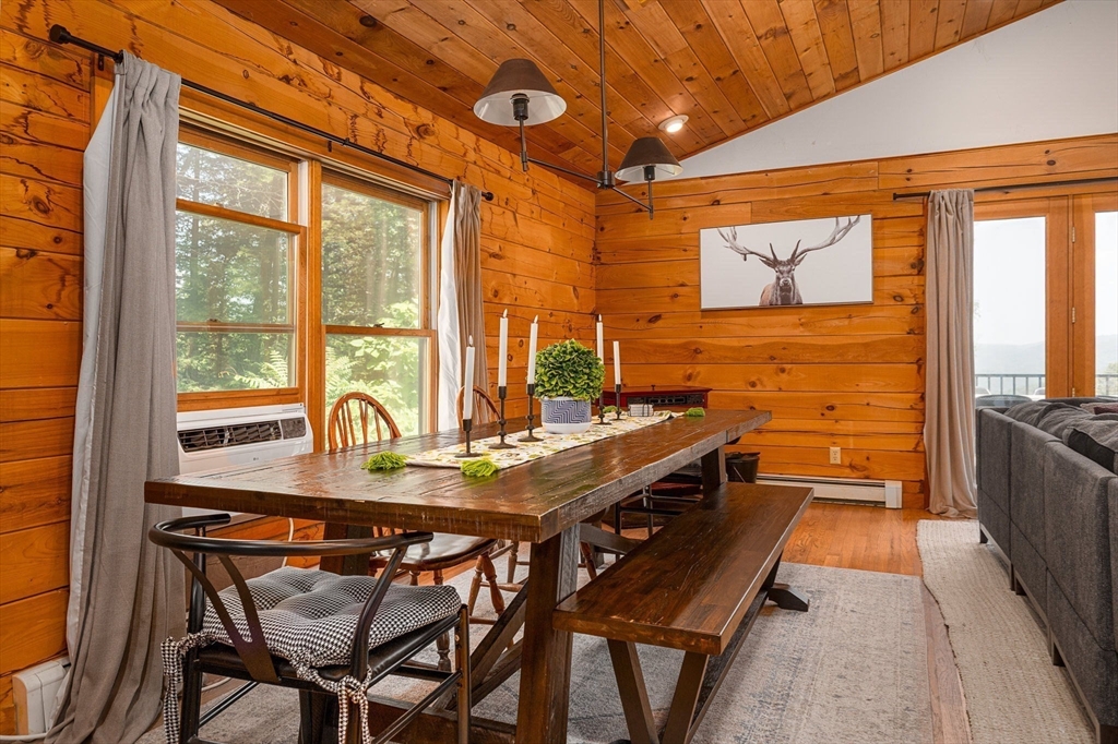 124 East Hawley Road Hawley, MA 01339 - Photo 5 of 39 a view of a dining room with furniture large window and wooden floor