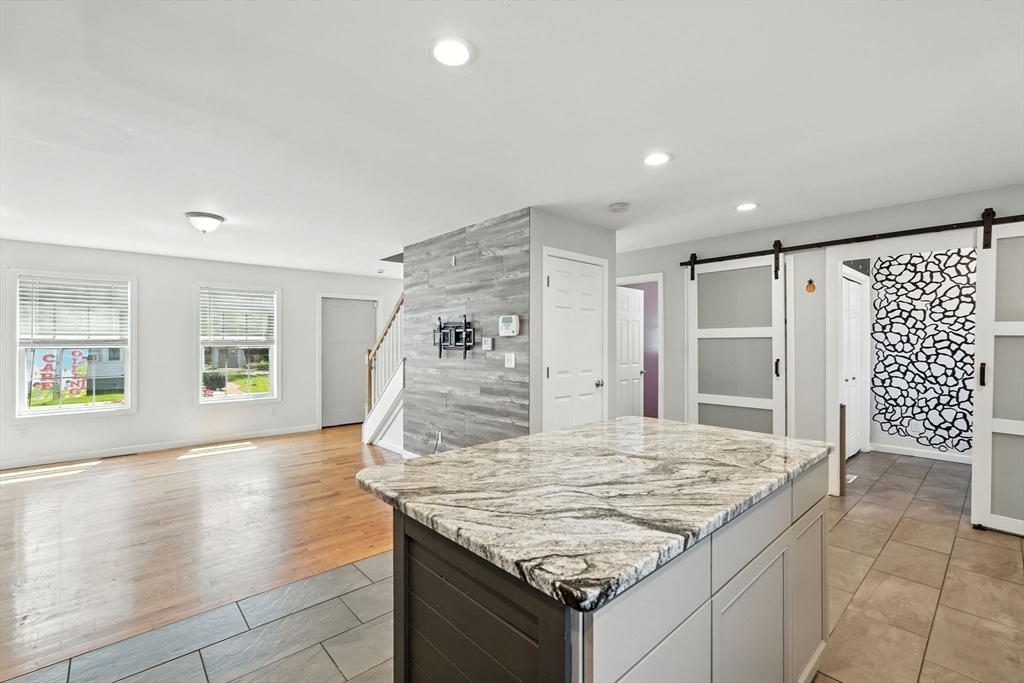 24 Porter Street Springfield, MA 01104 - Photo 14 of 42 a kitchen with granite countertop sink and refrigerator