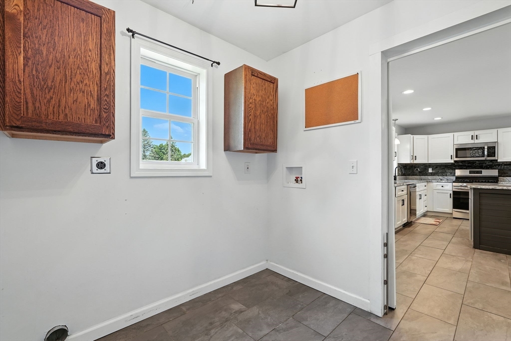 24 Porter Street Springfield, MA 01104 - Photo 18 of 42 a view of kitchen with wooden floor and electronic appliances