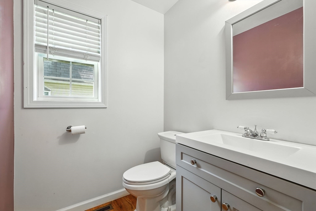24 Porter Street Springfield, MA 01104 - Photo 20 of 42 a bathroom with a sink mirror and toilet