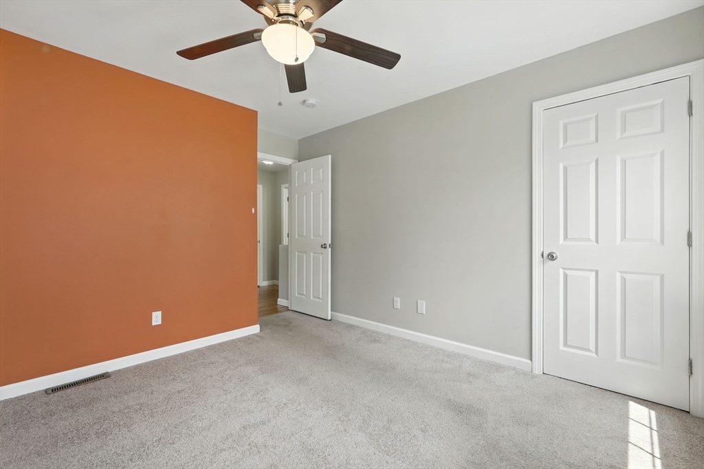 24 Porter Street Springfield, MA 01104 - Photo 31 of 42 an empty room with chandelier fan