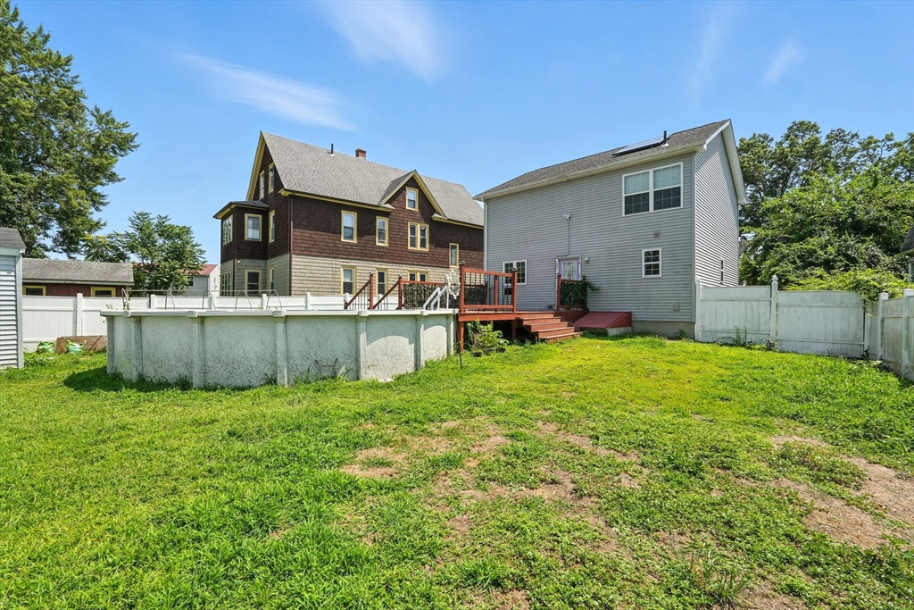 24 Porter Street Springfield, MA 01104 - Photo 39 of 42 a view of a house with backyard and sitting area