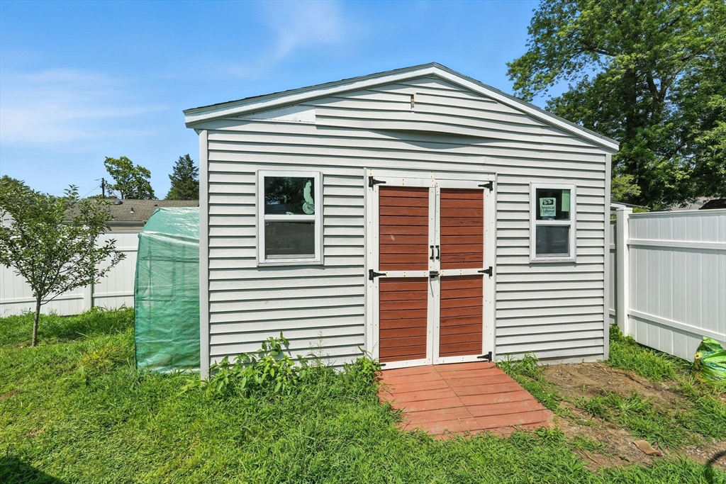 24 Porter Street Springfield, MA 01104 - Photo 40 of 42 a front view of a house with a yard