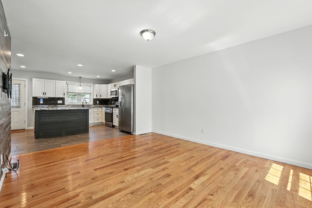 24 Porter Street Springfield, MA 01104 - Photo 7 of 42 a view of kitchen with wooden floor