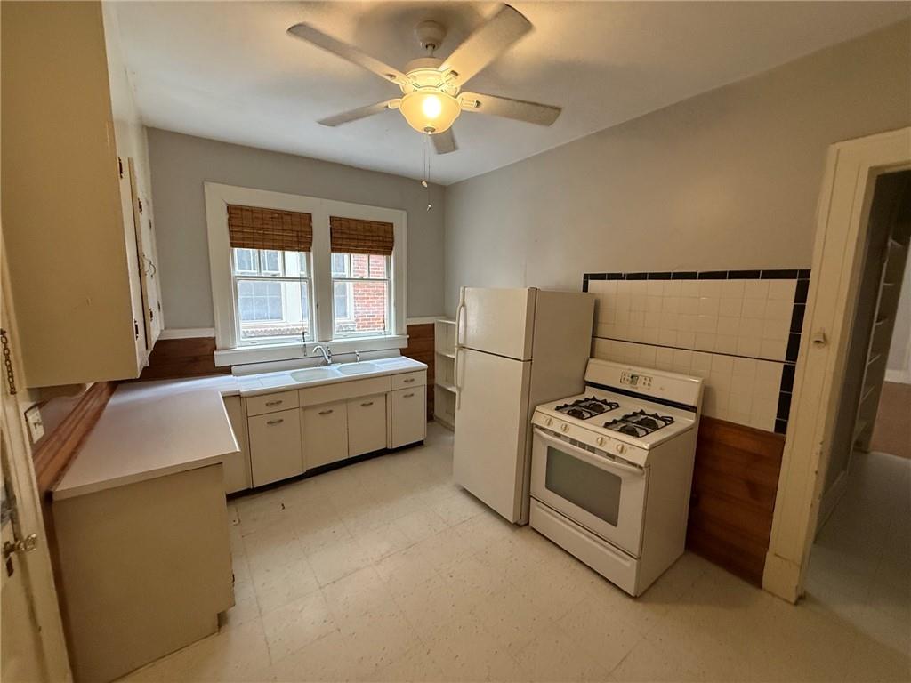 846 Briarcliff Road Northeast Atlanta, GA 30306 - Photo 13 of 22 a kitchen with sink a stove and refrigerator