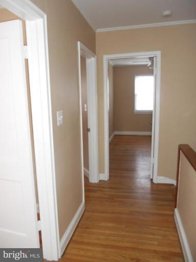 844 Bradhurst Road Baltimore, MD 21212 - Photo 13 of 17 a view of hallway with wooden floor
