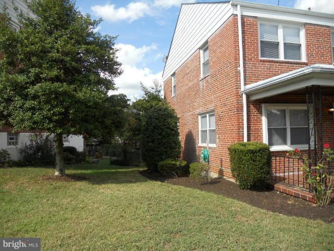 844 Bradhurst Road Baltimore, MD 21212 - Photo 14 of 17 a front view of a house with garden