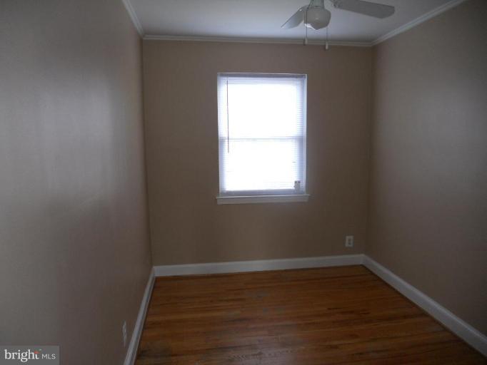 844 Bradhurst Road Baltimore, MD 21212 - Photo 15 of 17 a empty room with a window
