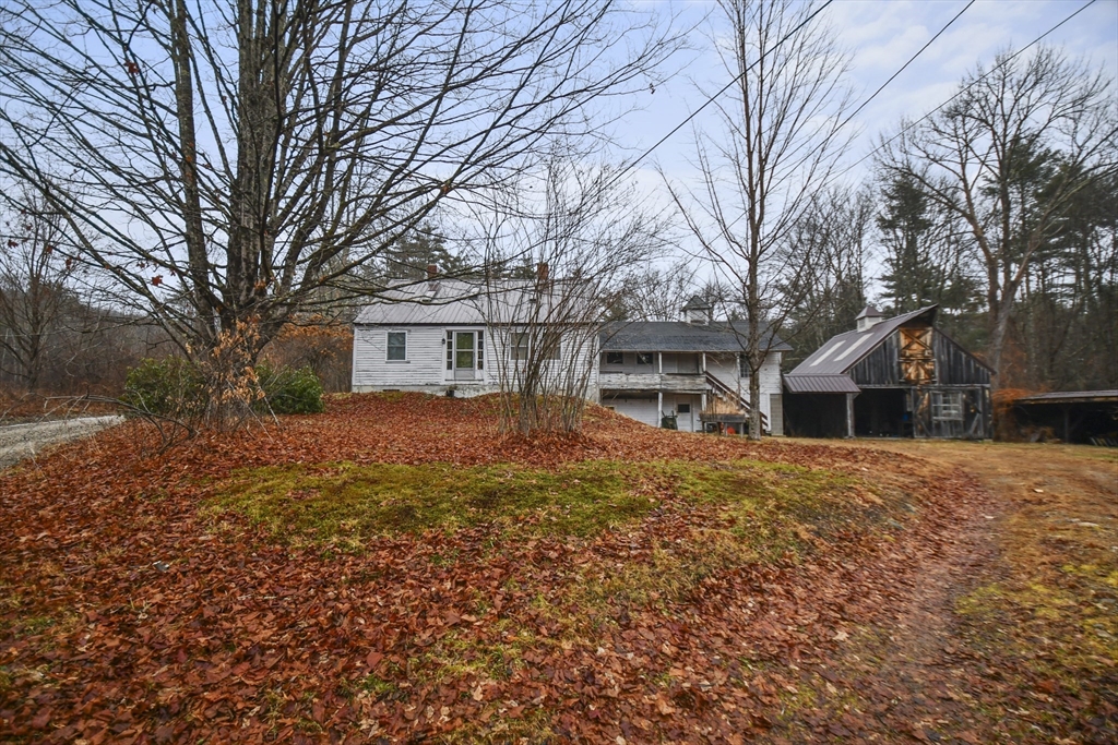 56 Pine Hill Road Orange, MA 01364 - Photo 21 of 30 a front view of house with yard and trees around