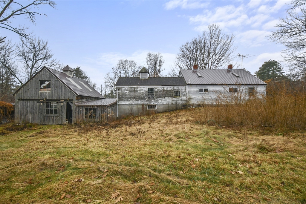 56 Pine Hill Road Orange, MA 01364 - Photo 22 of 30 a front view of a house with a yard