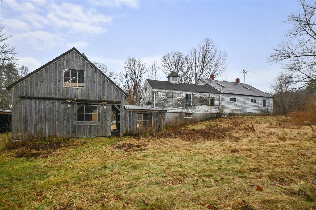 56 Pine Hill Road Orange, MA 01364 - Photo 23 of 30 a front view of house with yard and garage