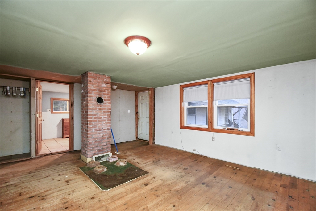 56 Pine Hill Road Orange, MA 01364 - Photo 6 of 30 a bedroom with a bed and a window