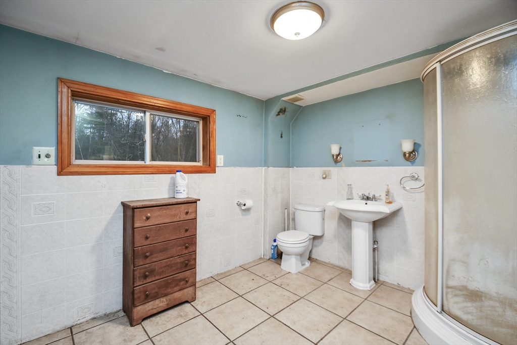 56 Pine Hill Road Orange, MA 01364 - Photo 8 of 30 a bathroom with a sink toilet and mirror