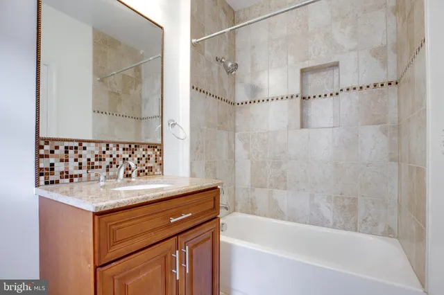 a view of washer and dryer with kitchen in the background