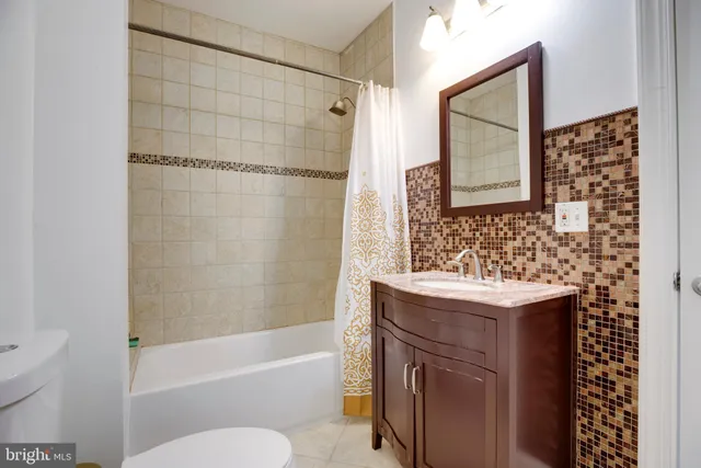 a living room with furniture gym equipment and a window