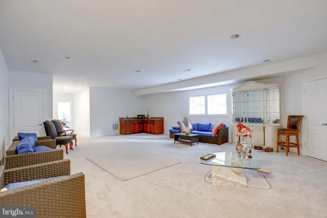 a view of a swimming pool with outdoor seating