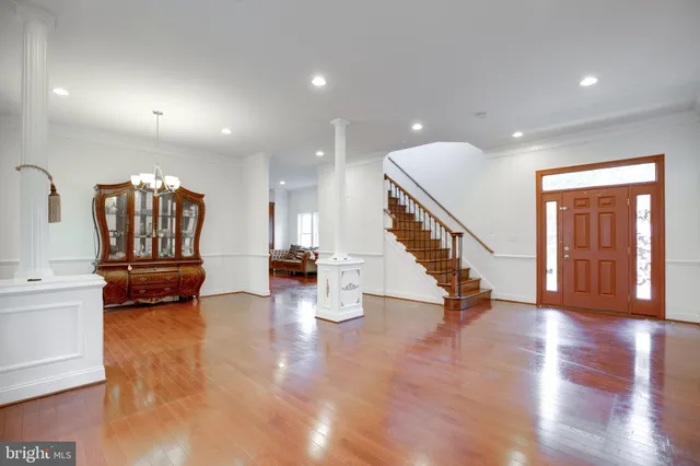a view of an entryway with wooden floor