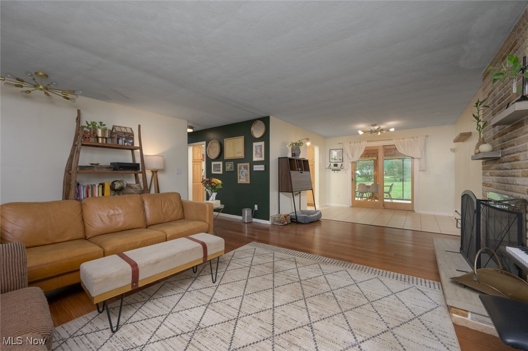 1177 Munroe Falls Kent Road Kent, OH 44240 - Photo 26 of 47 Living room featuring a fireplace, California bamboo hardwood flooring