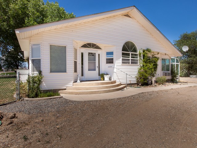 1280 20 Road Fruita, CO 81521 - Photo 2 of 41 a front view of a house with a yard