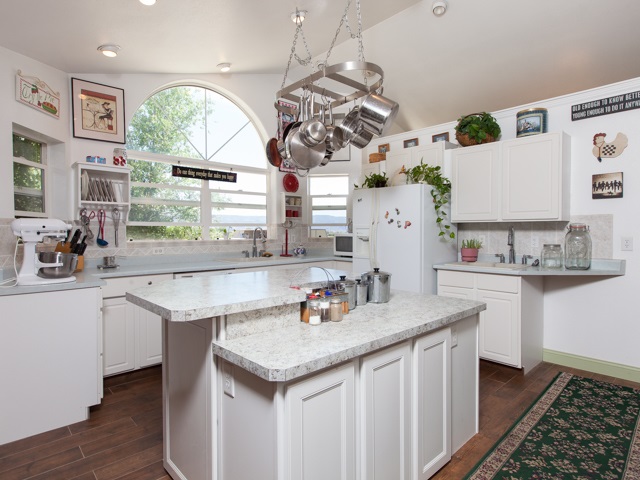 1280 20 Road Fruita, CO 81521 - Photo 22 of 41 a kitchen with a sink a window and cabinets