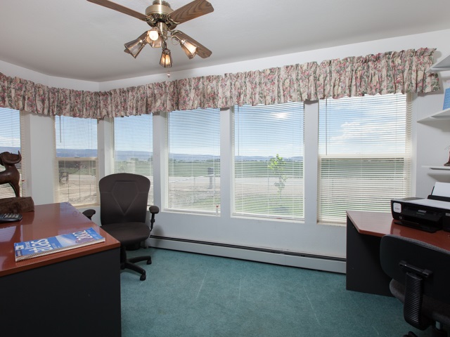 1280 20 Road Fruita, CO 81521 - Photo 27 of 41 a view of a workspace with furniture and a window