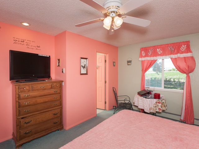 1280 20 Road Fruita, CO 81521 - Photo 29 of 41 a bedroom with furniture and flat screen tv