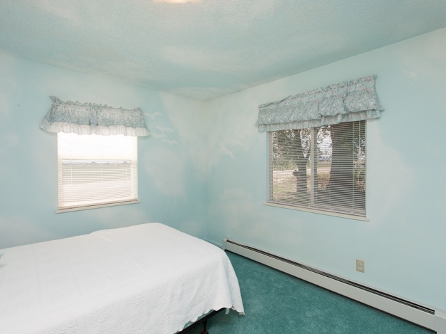 1280 20 Road Fruita, CO 81521 - Photo 32 of 41 a bedroom with a bed and a window