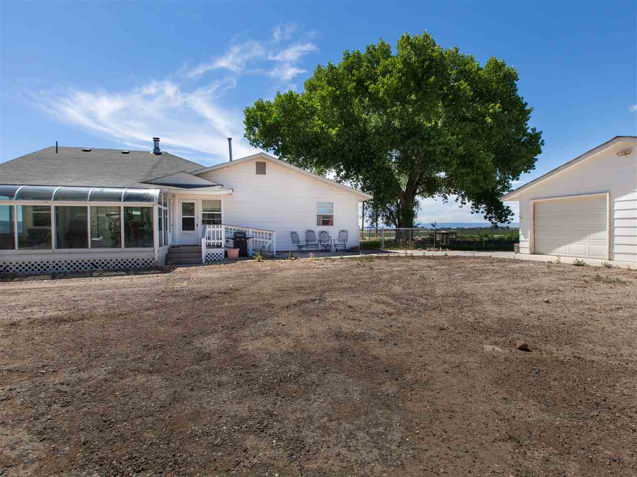 1280 20 Road Fruita, CO 81521 - Photo 41 of 41 a front view of a house with a yard and trees