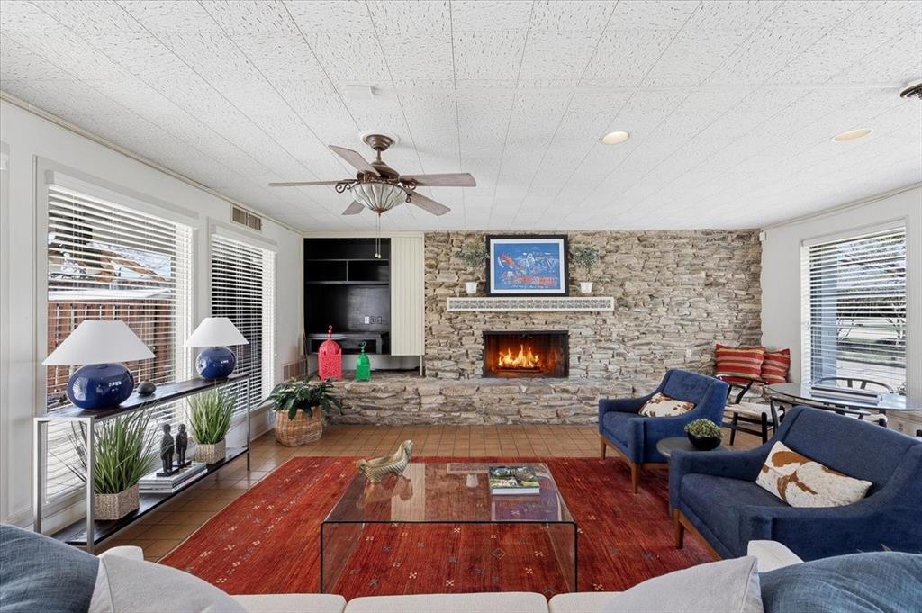 6321 Greenway Road Fort Worth, TX 76116 - Photo 2 of 40 Living area with plenty of natural light, a ceiling fan, a fireplace, and recessed lighting