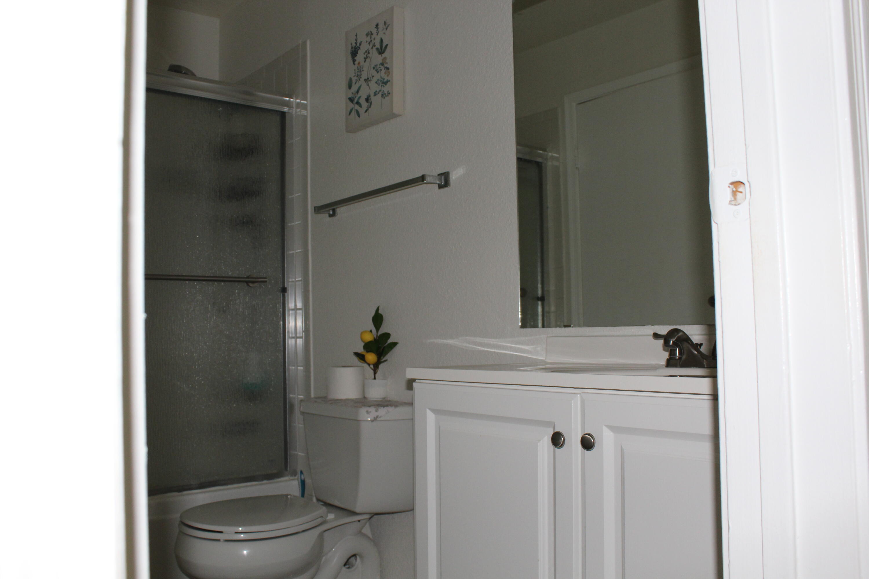 899 Riverside Drive, Unit 620 Coral Springs, FL 33071 - Photo 37 of 46 a bathroom with a sink toilet and shower