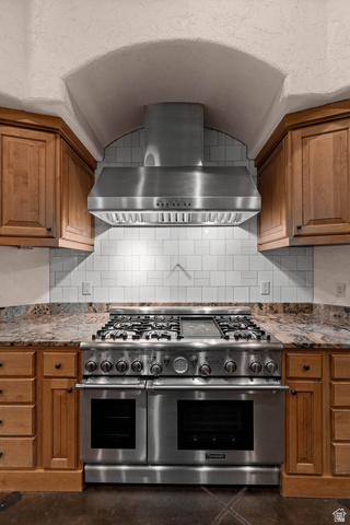 2464 East Granite Way St. George, UT 84790 - Photo 52 of 106 Kitchen with double oven range, wood finish cabinets, and light stone counters