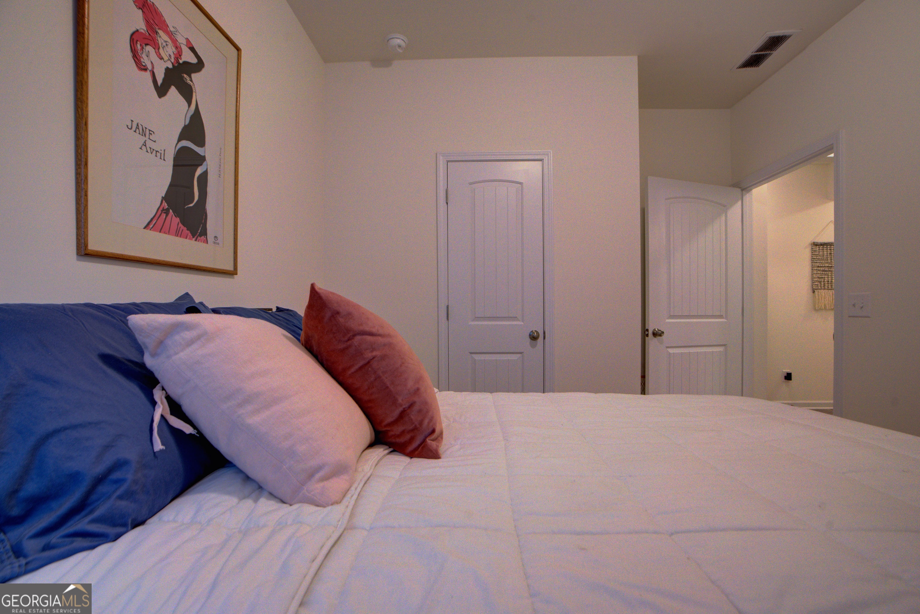 67 Willowrun Drive Rome, GA 30165 - Photo 15 of 24 a bedroom with a bed and a painting on the wall