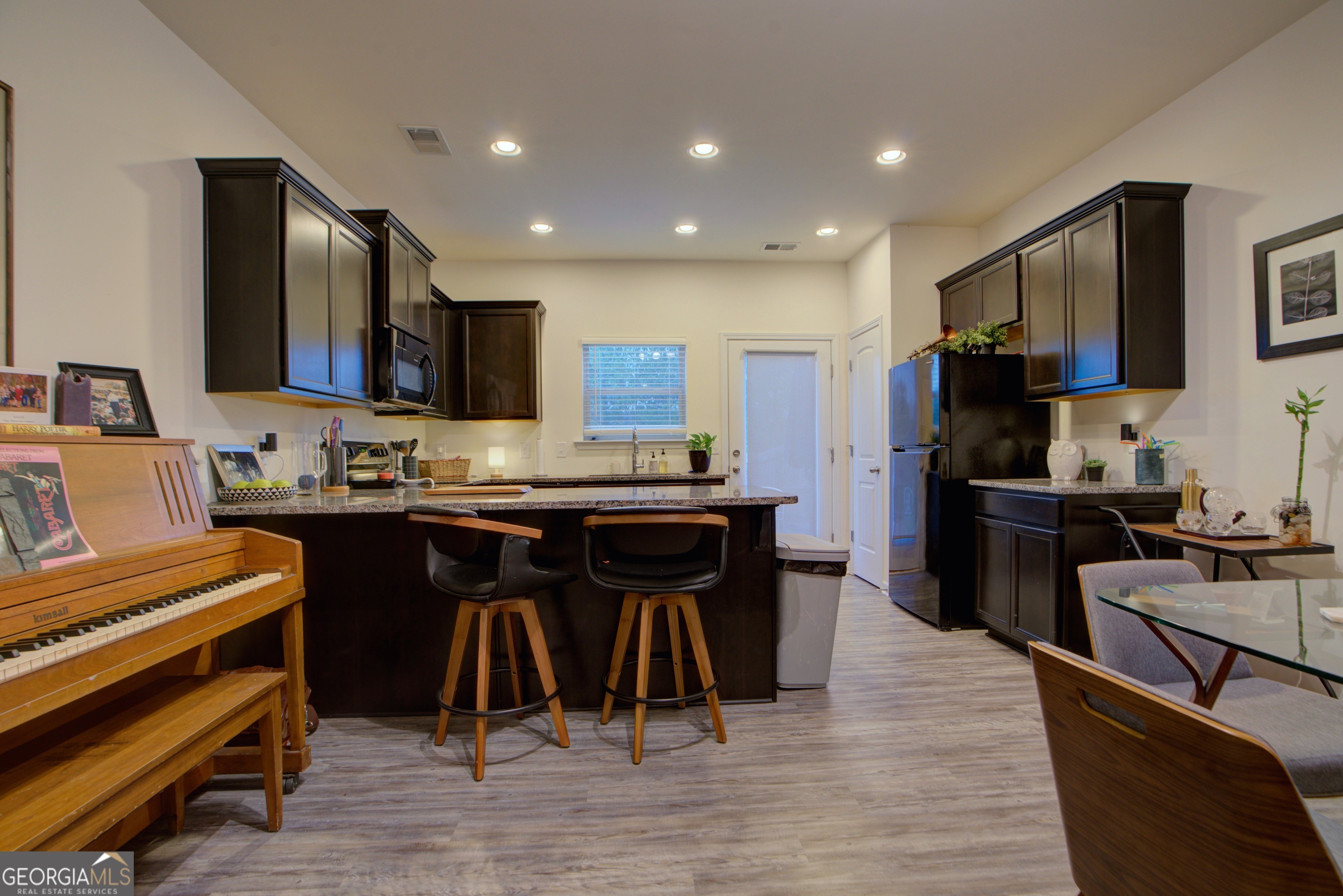 67 Willowrun Drive Rome, GA 30165 - Photo 6 of 24 a kitchen with stainless steel appliances kitchen island granite countertop a refrigerator a stove a sink and a microwave