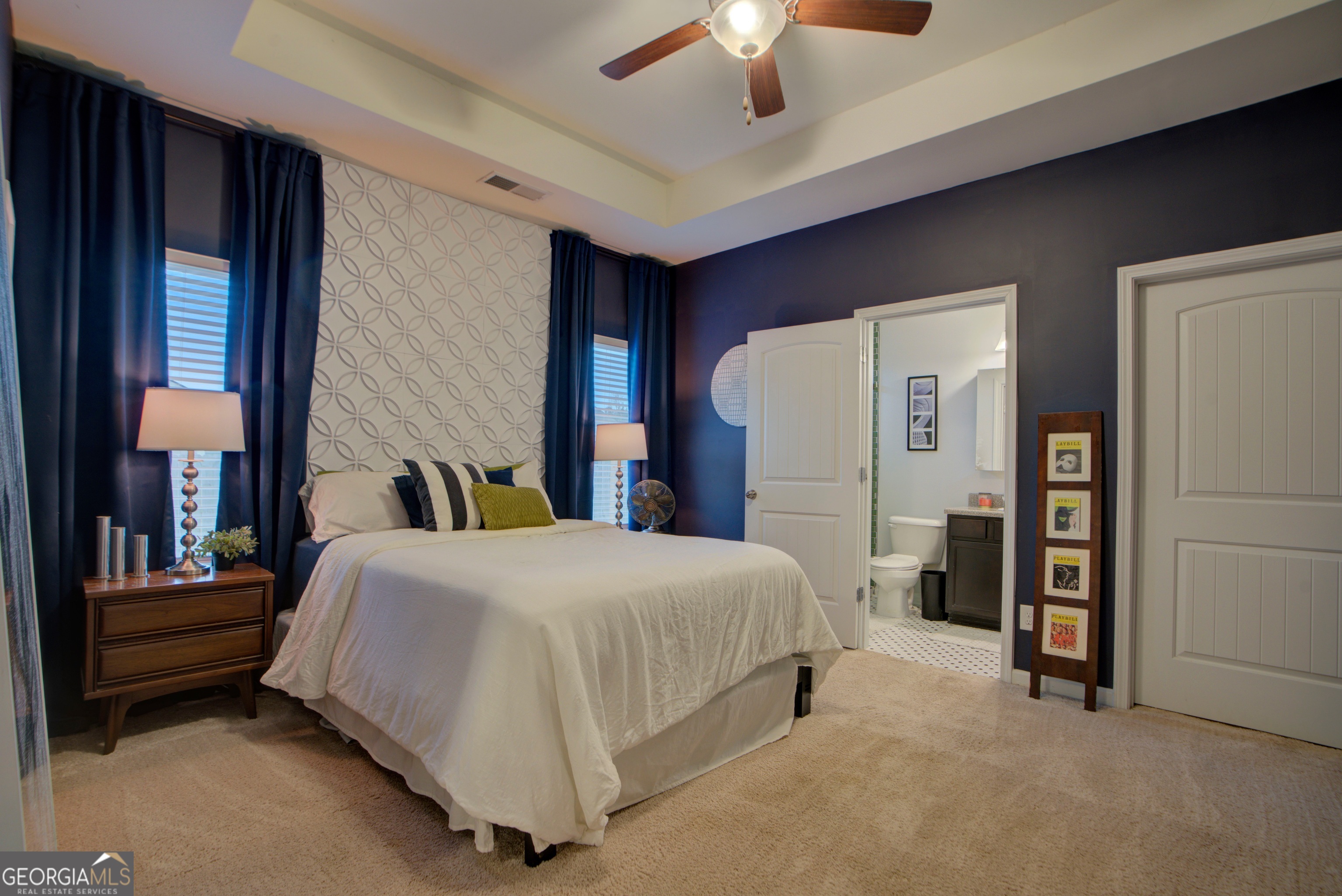 67 Willowrun Drive Rome, GA 30165 - Photo 10 of 24 a spacious bedroom with a bed and a chandelier