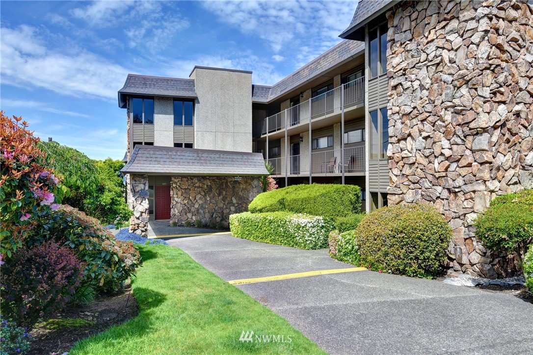 655 Main Street, Unit 204 Edmonds, WA 98020 - Photo 1 of 21 front view of a house with a garden