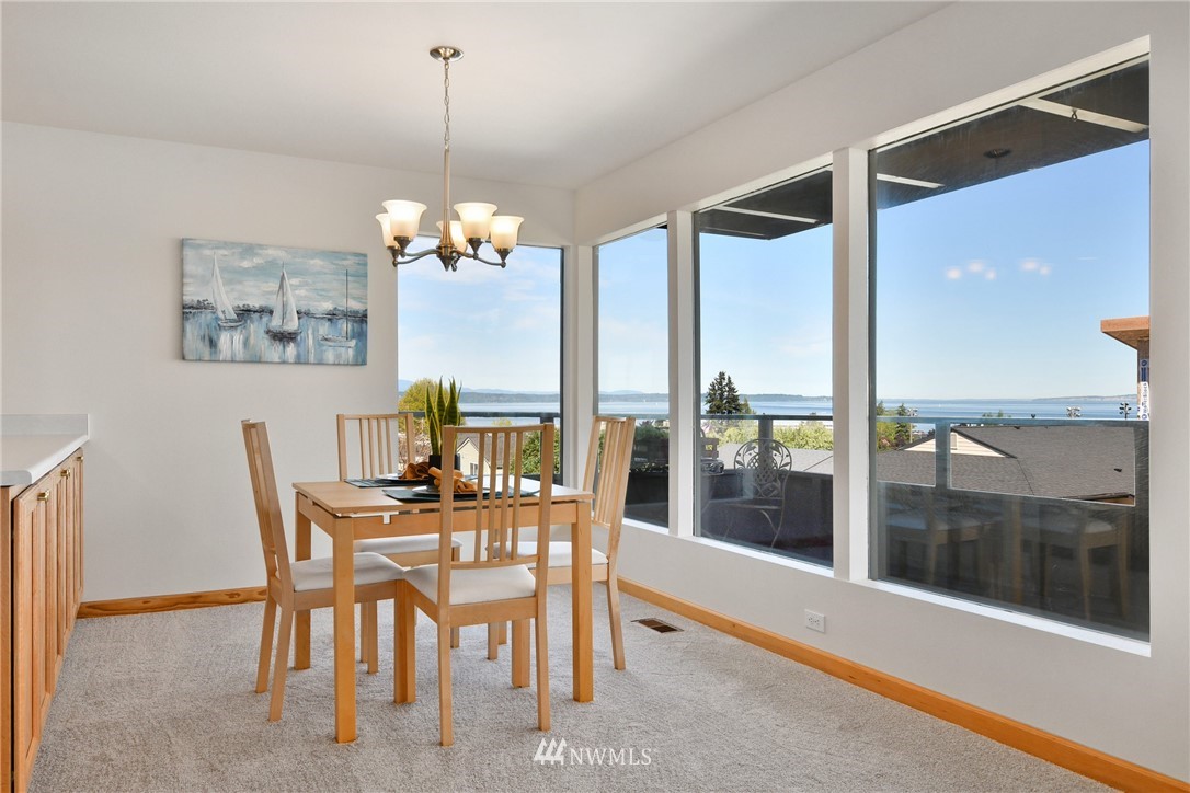 655 Main Street, Unit 204 Edmonds, WA 98020 - Photo 9 of 21 a dining room with furniture and window