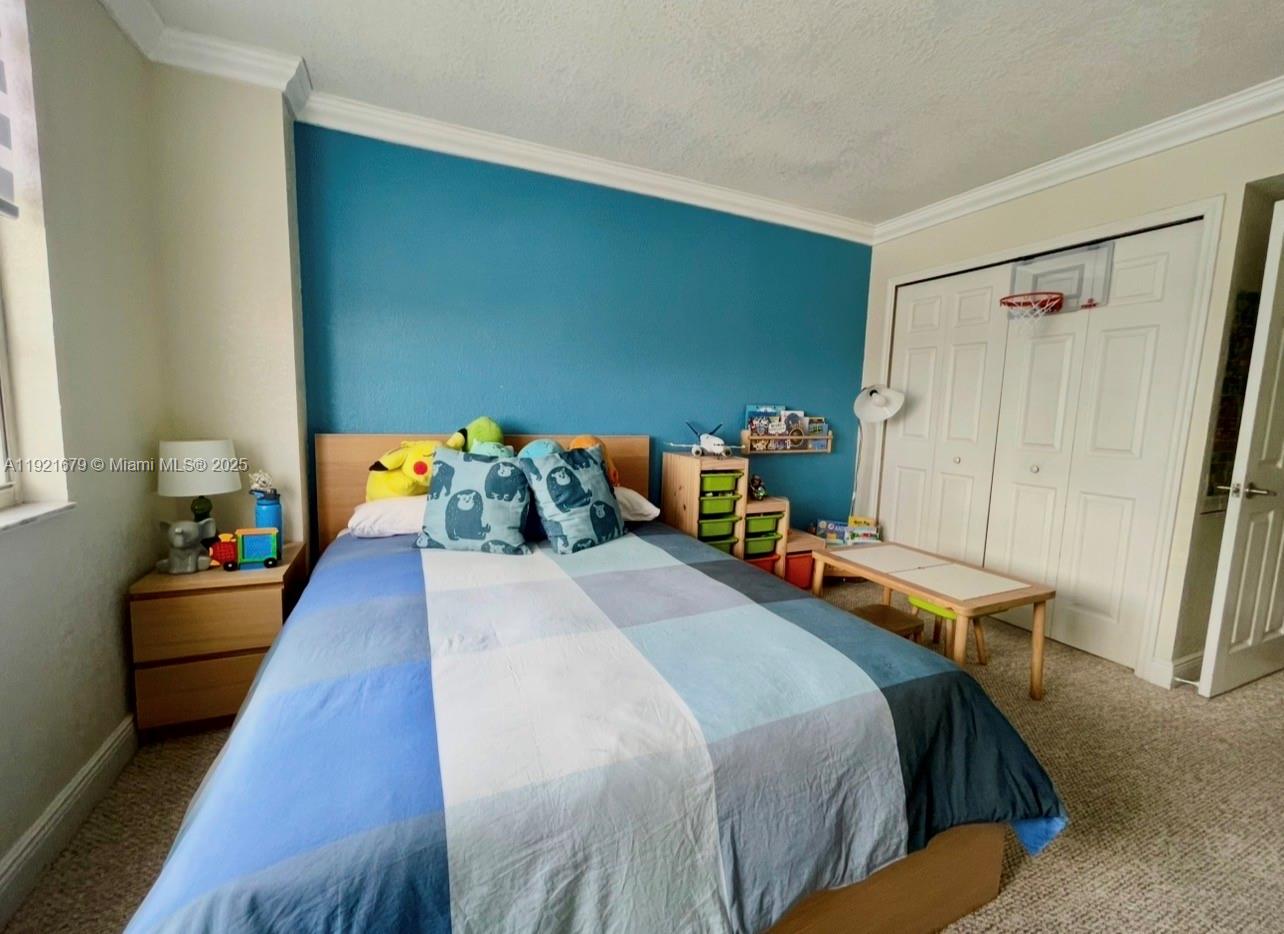 2851 Northeast 183rd Street, Unit 907E Aventura, FL 33160 - Photo 11 of 32 a bedroom with 2 bed and a table in it