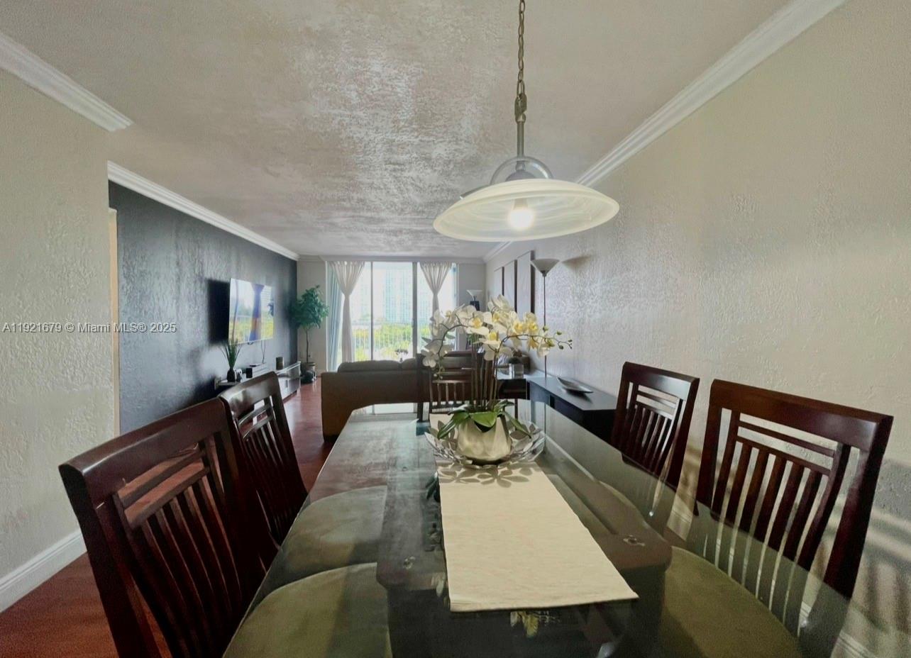 2851 Northeast 183rd Street, Unit 907E Aventura, FL 33160 - Photo 17 of 32 a view of a dining room with furniture window and wooden floor