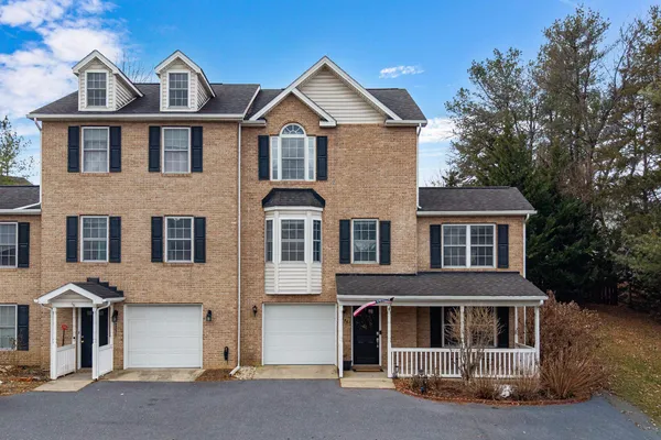 a kitchen with stainless steel appliances granite countertop a refrigerator a stove a sink a microwave and island