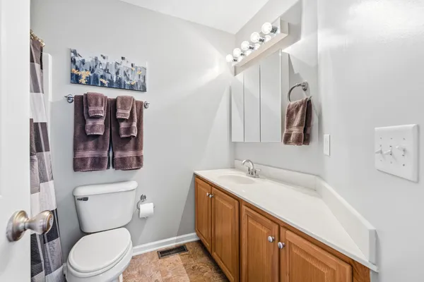 a view of a chair and table in the balcony
