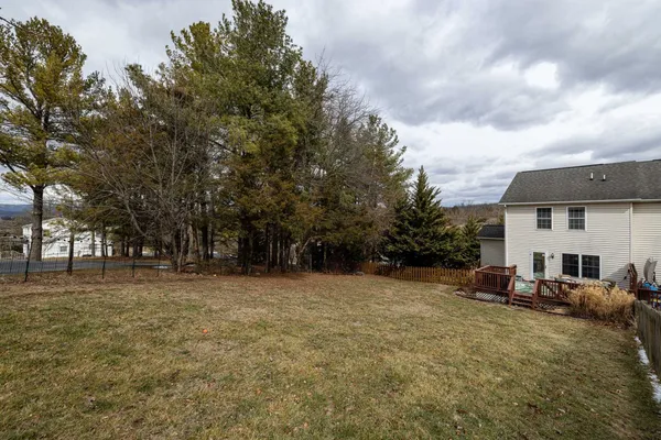 an aerial view of a house with outdoor space