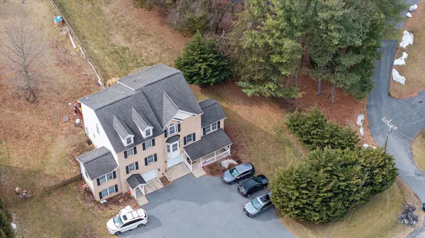 an aerial view of a house with a swimming pool