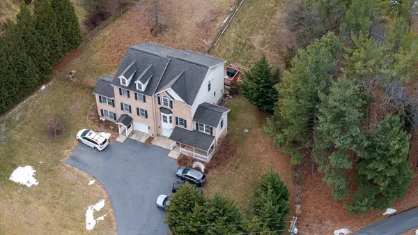 an aerial view of residential houses with outdoor space