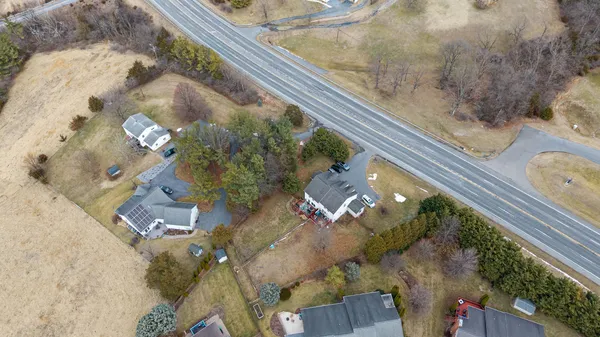 an aerial view of residential houses with outdoor space