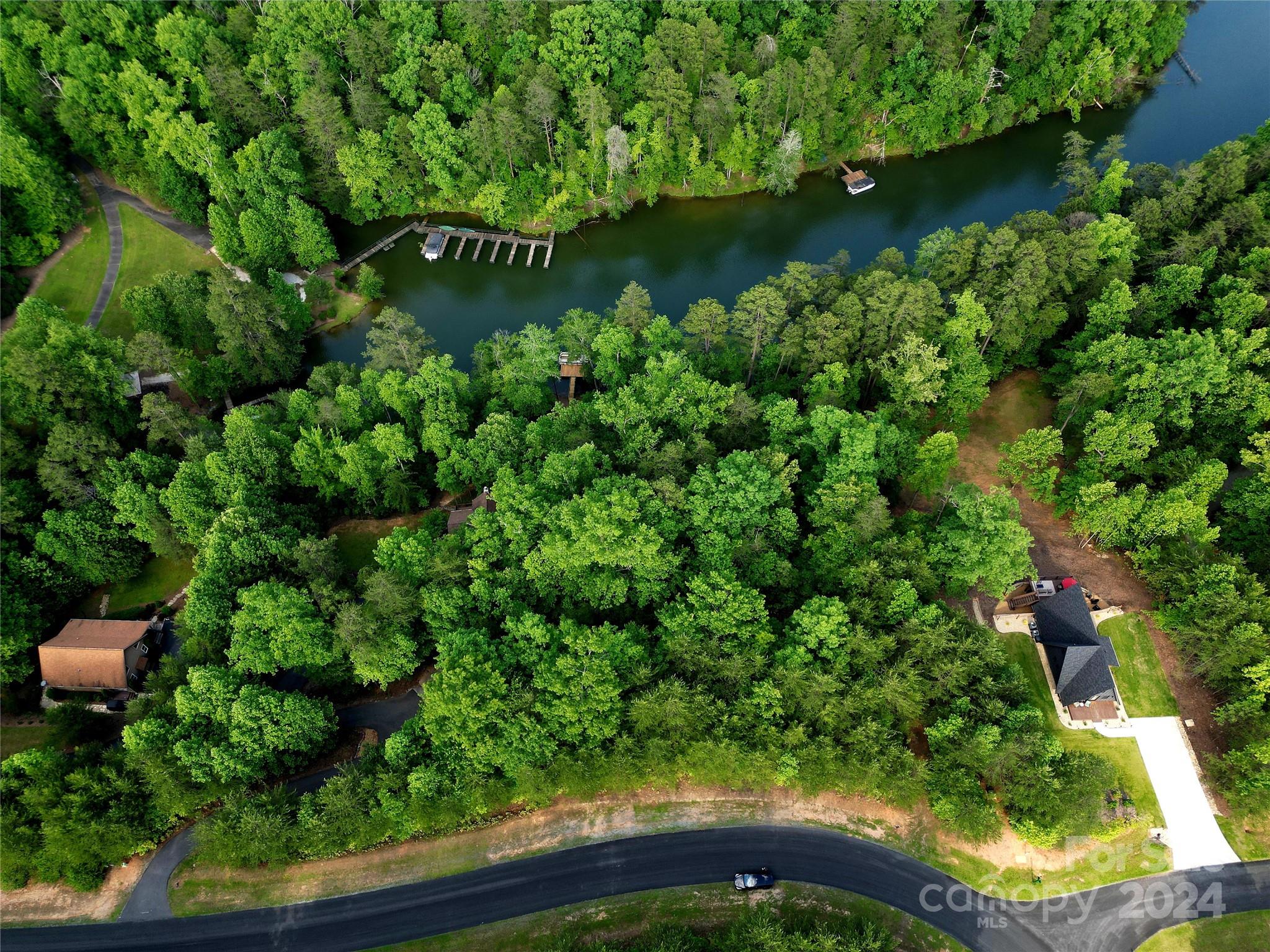 Tbd Tbd Parkway Rd Mill Spring Mill Spring, NC 28756 - Photo 5 of 36 an aerial view of a golf course with a lake view