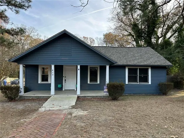 a front view of a house with a garage
