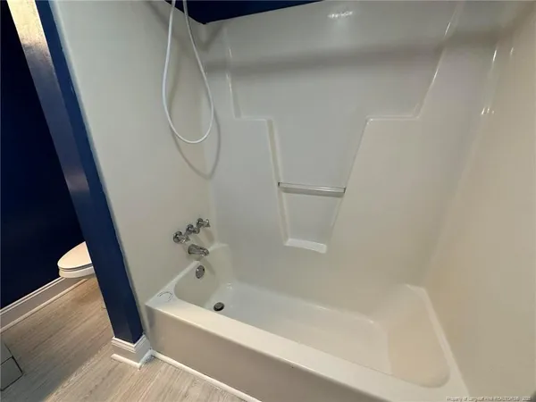 a bathroom with a bath tub