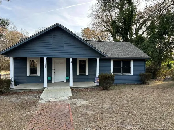 a front view of a house with yard in front of it