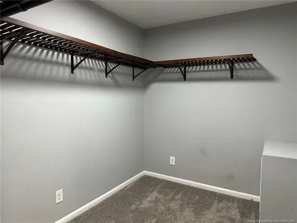 a view of a hallway with staircase