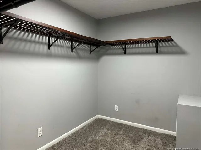 a view of a hallway with staircase